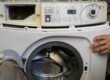 Leo’s Electrical technician repairing a washing machine in Birmingham