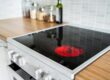 Electric oven repair engineer replacing faulty heating element in Birmingham
